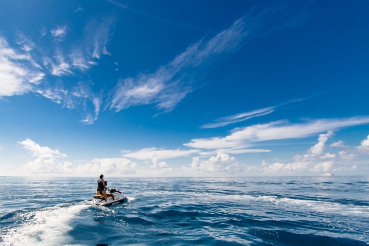 a man riding a wave on top of a body of water